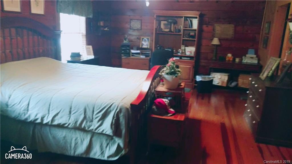 767 Holly Ridge Road Grover, NC 28073 - Photo 17 of 26 a bed sitting in a bedroom next to a window