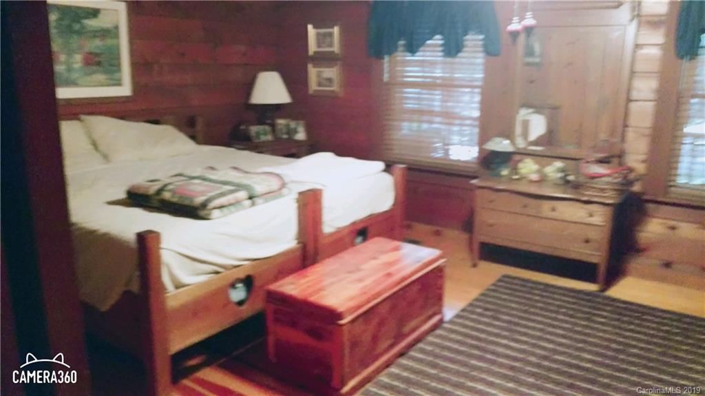 767 Holly Ridge Road Grover, NC 28073 - Photo 20 of 26 a bed sitting in a bedroom next to a window