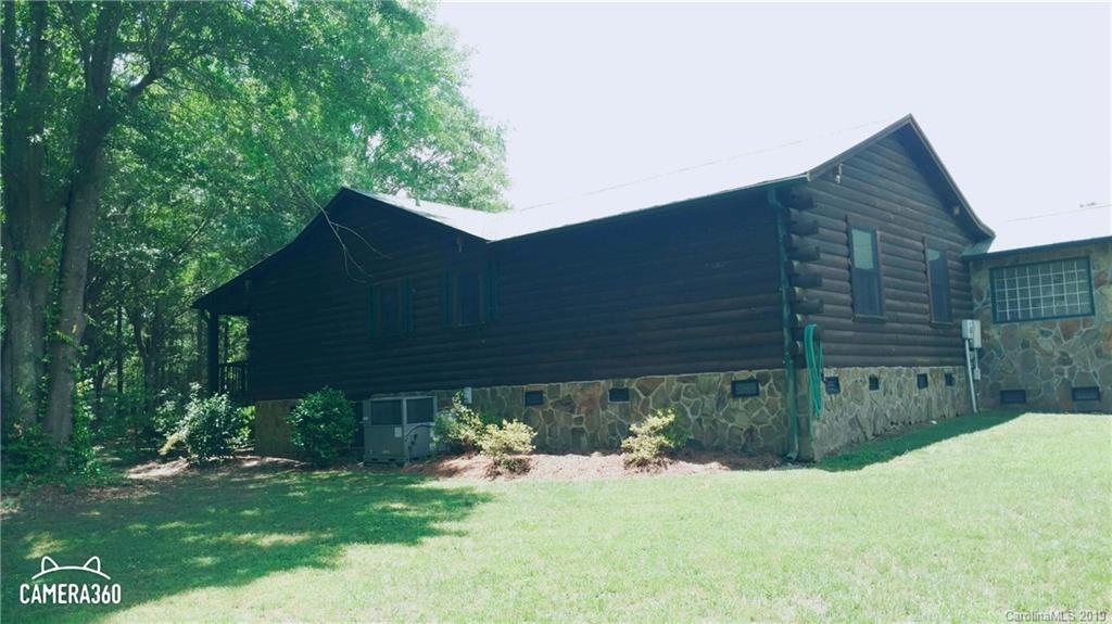 767 Holly Ridge Road Grover, NC 28073 - Photo 3 of 26 a backyard of a house with seating space
