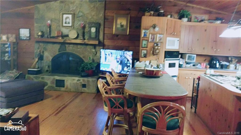 767 Holly Ridge Road Grover, NC 28073 - Photo 23 of 26 a dining room with furniture and wooden floor