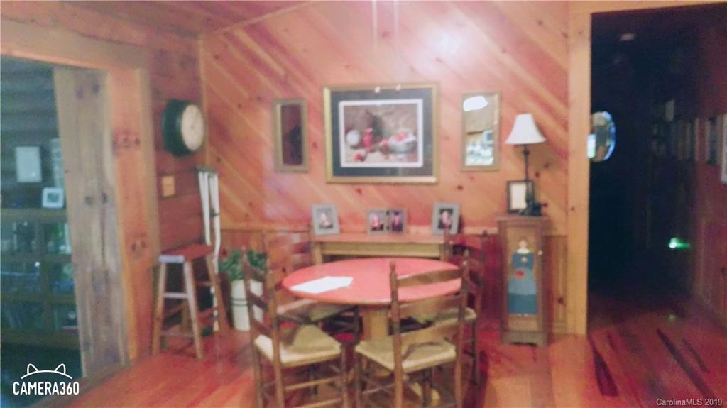 767 Holly Ridge Road Grover, NC 28073 - Photo 25 of 26 a view of a dining room with furniture and wooden floor