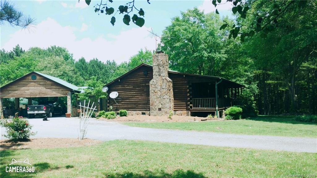 767 Holly Ridge Road Grover, NC 28073 - Photo 5 of 26 a view of a house with backyard and a tree