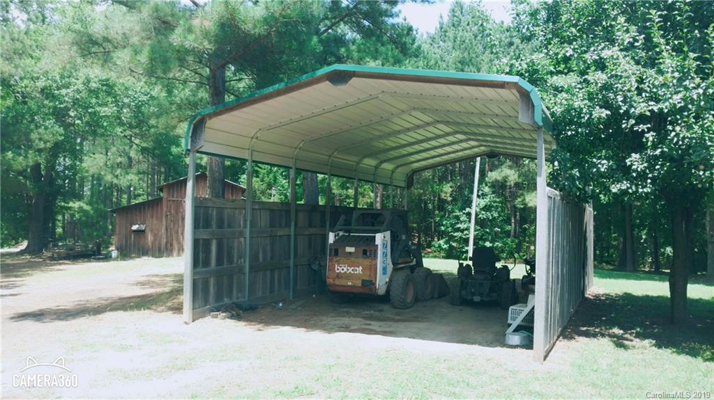 767 Holly Ridge Road Grover, NC 28073 - Photo 8 of 26 a backyard of a house with seating space