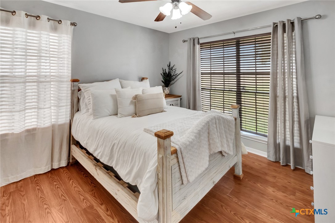 399 Keefe Road Victoria, TX 77905 - Photo 19 of 33 a bedroom with a bed and a large window