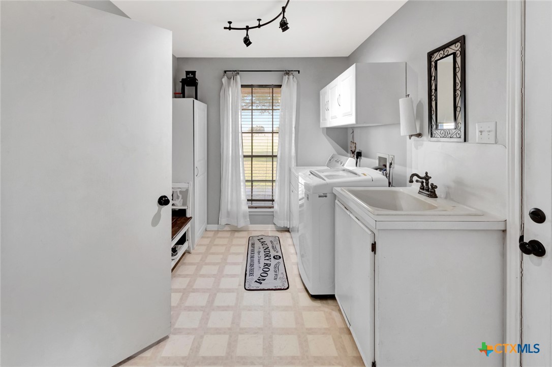 399 Keefe Road Victoria, TX 77905 - Photo 23 of 33 a bathroom with a sink a toilet and mirror