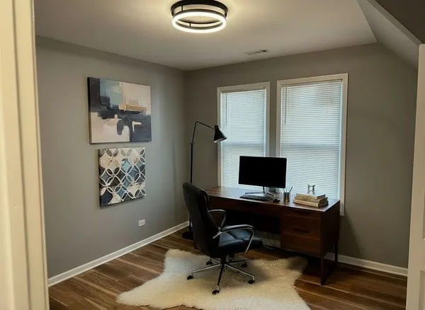 a bedroom with a large bed and a flat screen tv