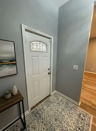 a view of a hallway with stairs