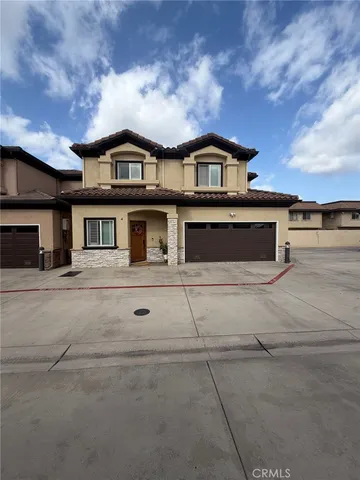 a front view of a house with a garage