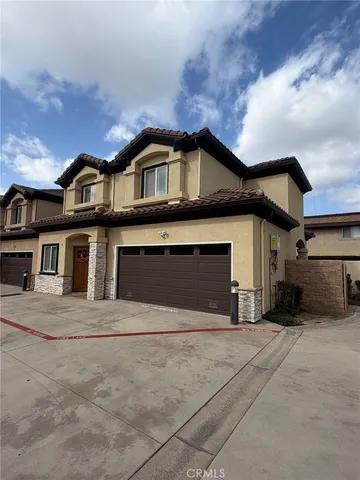 a front view of a house with a garage