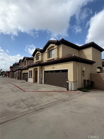 a front view of a house with a garage