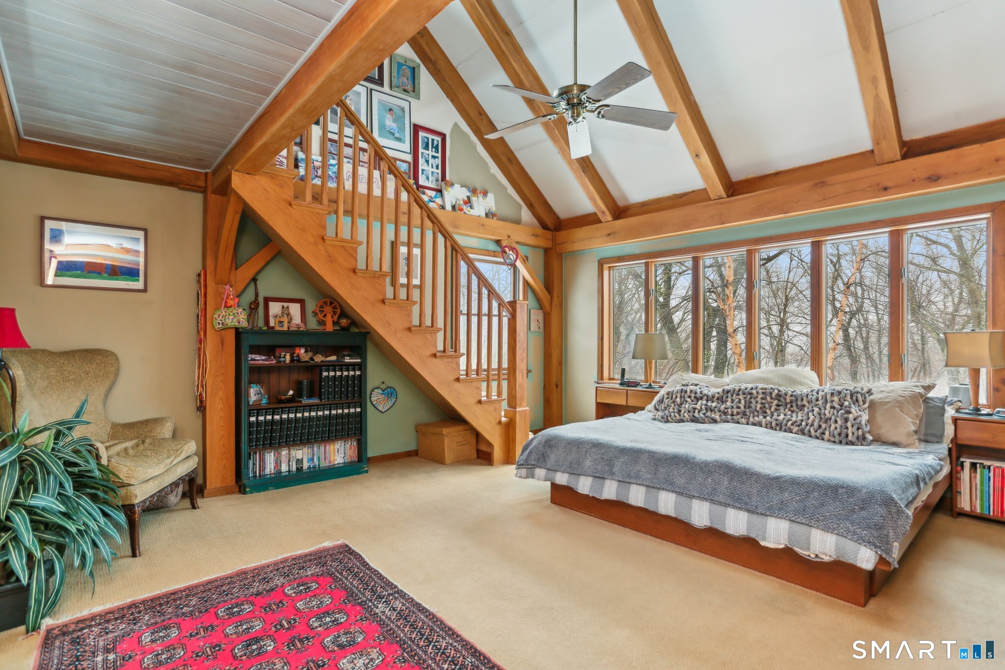 142 Seventy Acre Road Redding, CT 06896 - Photo 17 of 40 a spacious bedroom with a bed and a large window