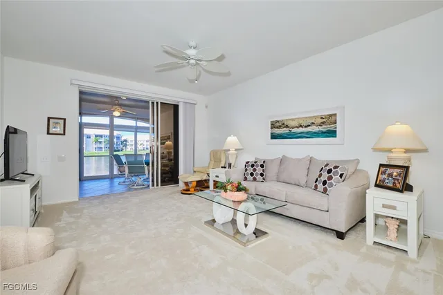 a view of a livingroom with furniture and a window