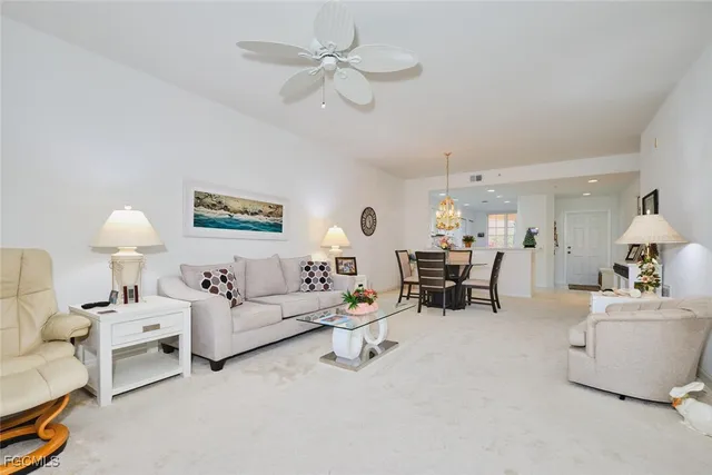 a spacious bedroom with a bed and a cabinets
