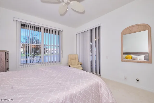 a bedroom with a bed and a mirror