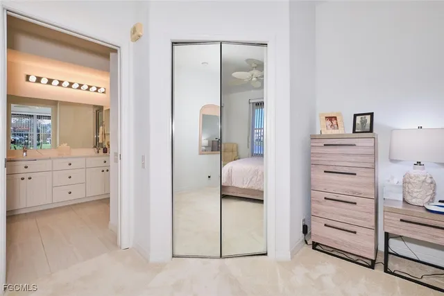 a bathroom with a double vanity sink mirror and shower