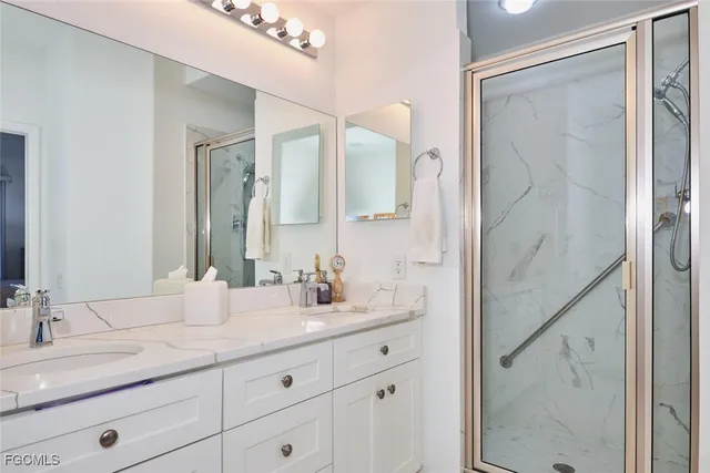 a picture of a bathroom with a shower