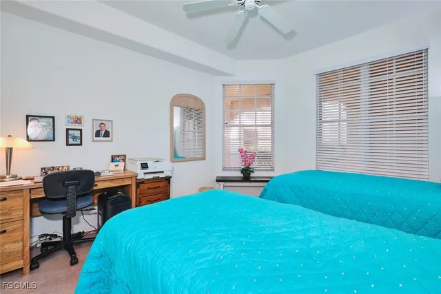 a bathroom with a sink vanity mirror and toilet