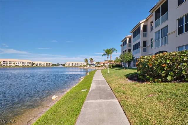 a city view with lake view and mountain view in back
