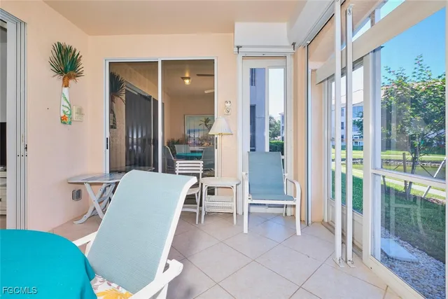 a room with furniture and a potted plant