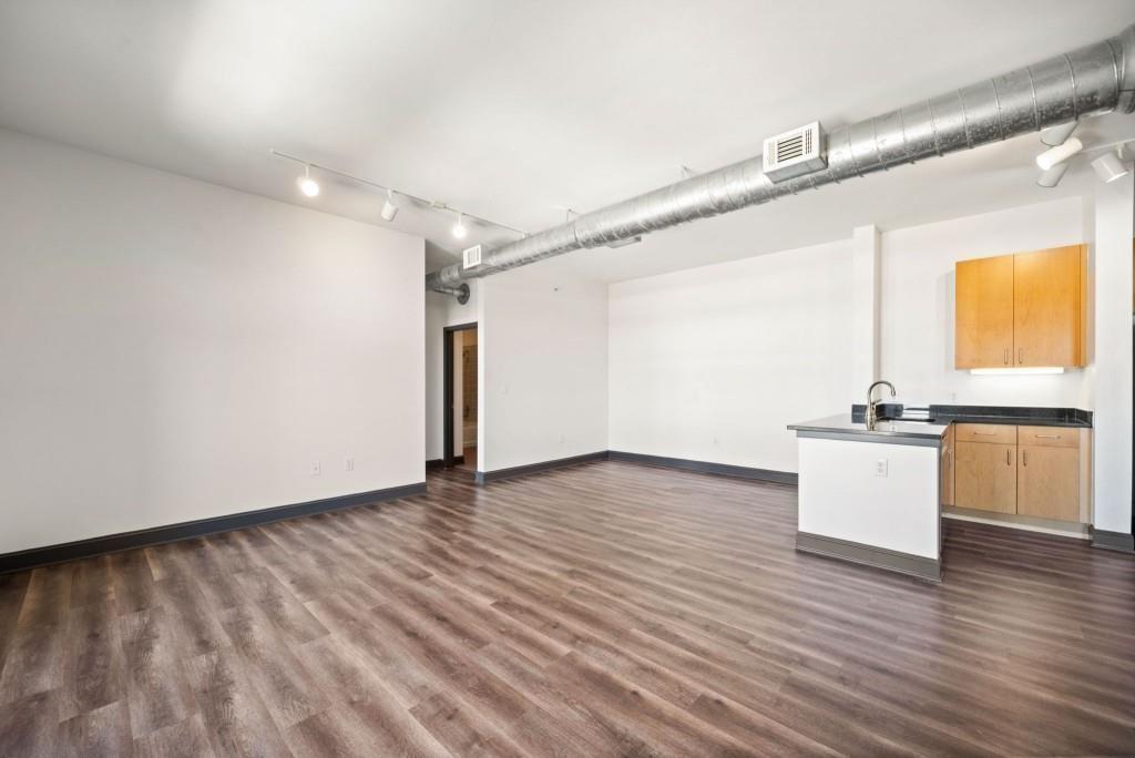 5300 Peachtree Road, Unit 3507 Atlanta, GA 30341 - Photo 16 of 32 a view of an empty room with a window and wooden floor
