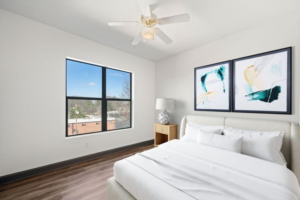 5300 Peachtree Road, Unit 3507 Atlanta, GA 30341 - Photo 22 of 32 a bedroom with a bed and a painting on the wall