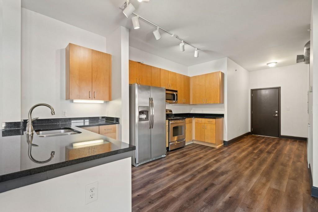 5300 Peachtree Road, Unit 3507 Atlanta, GA 30341 - Photo 10 of 32 a kitchen with refrigerator and cabinets