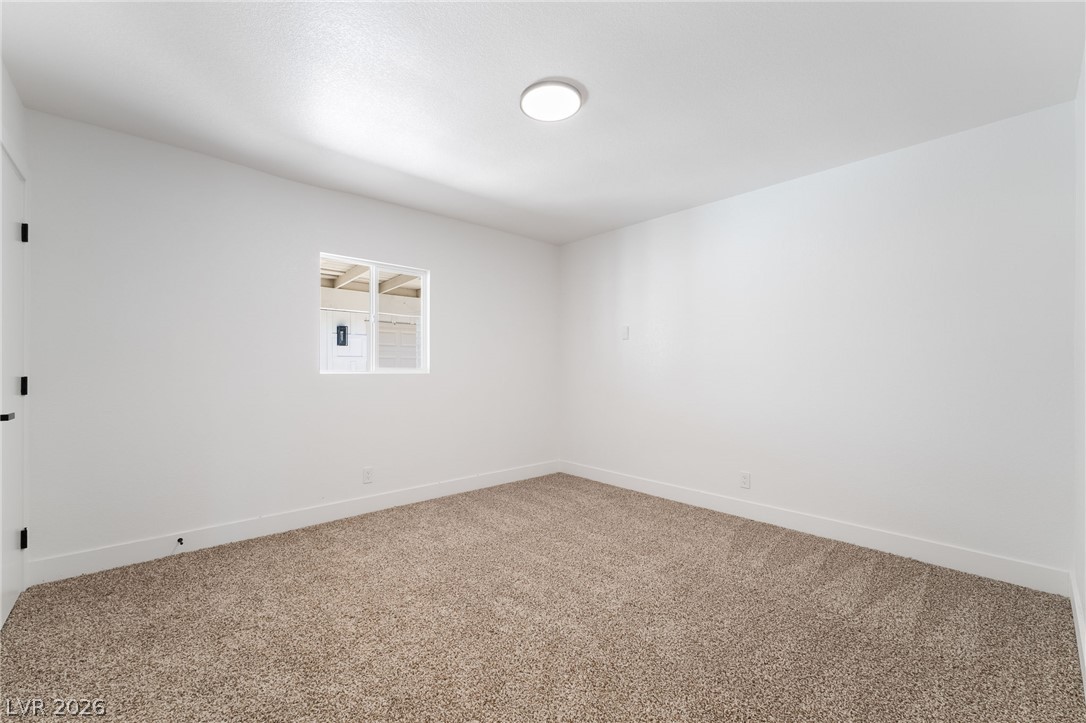 39 Lowery Street Henderson, NV 89015 - Photo 21 of 40 A well-lit, quiet space awaits, offering a blank canvas for your personal style and comfort.
