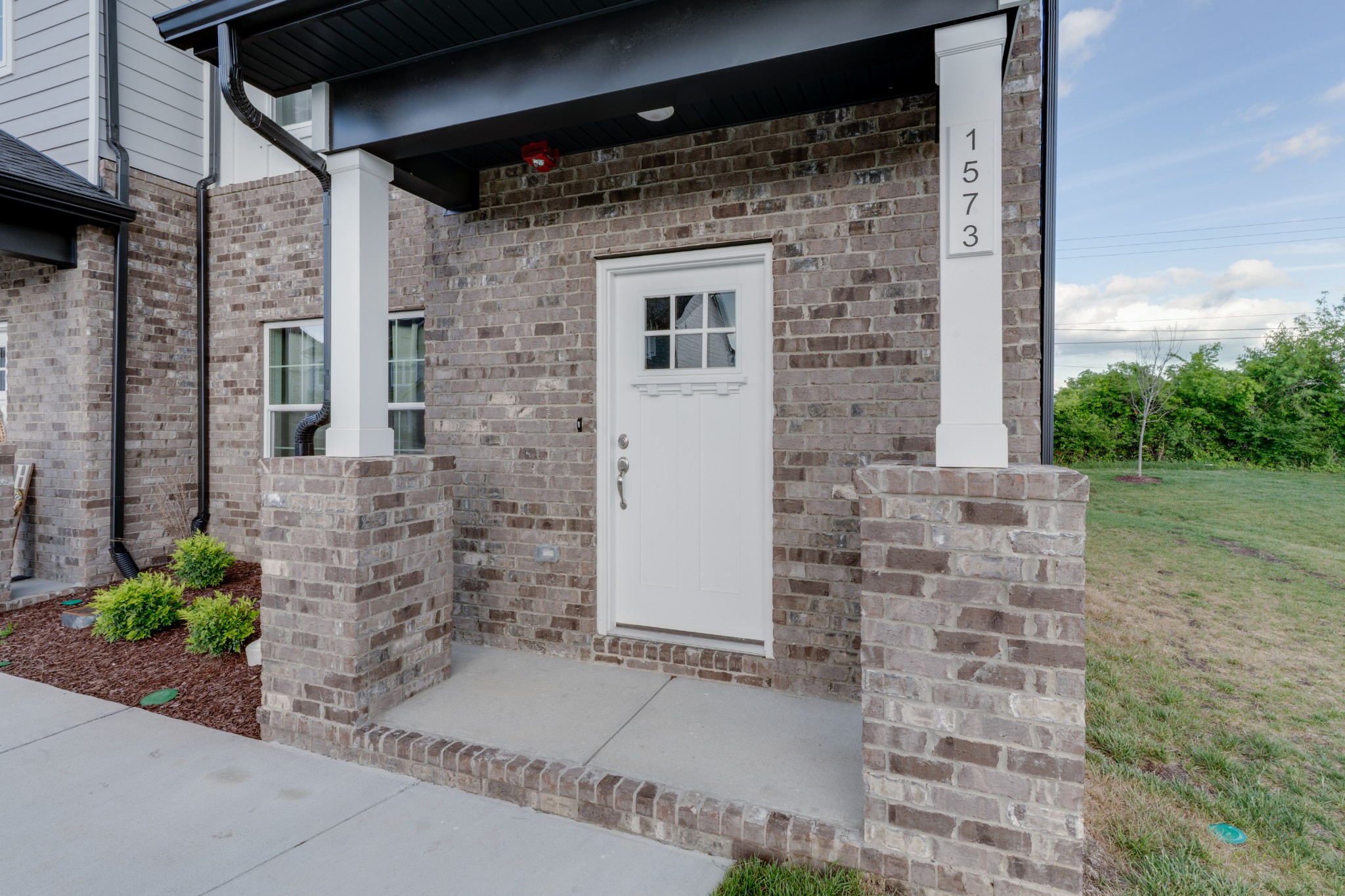 1573 Elliott Williams Way Gallatin, TN 37066 - Photo 1 of 32 a brick house with a large windows