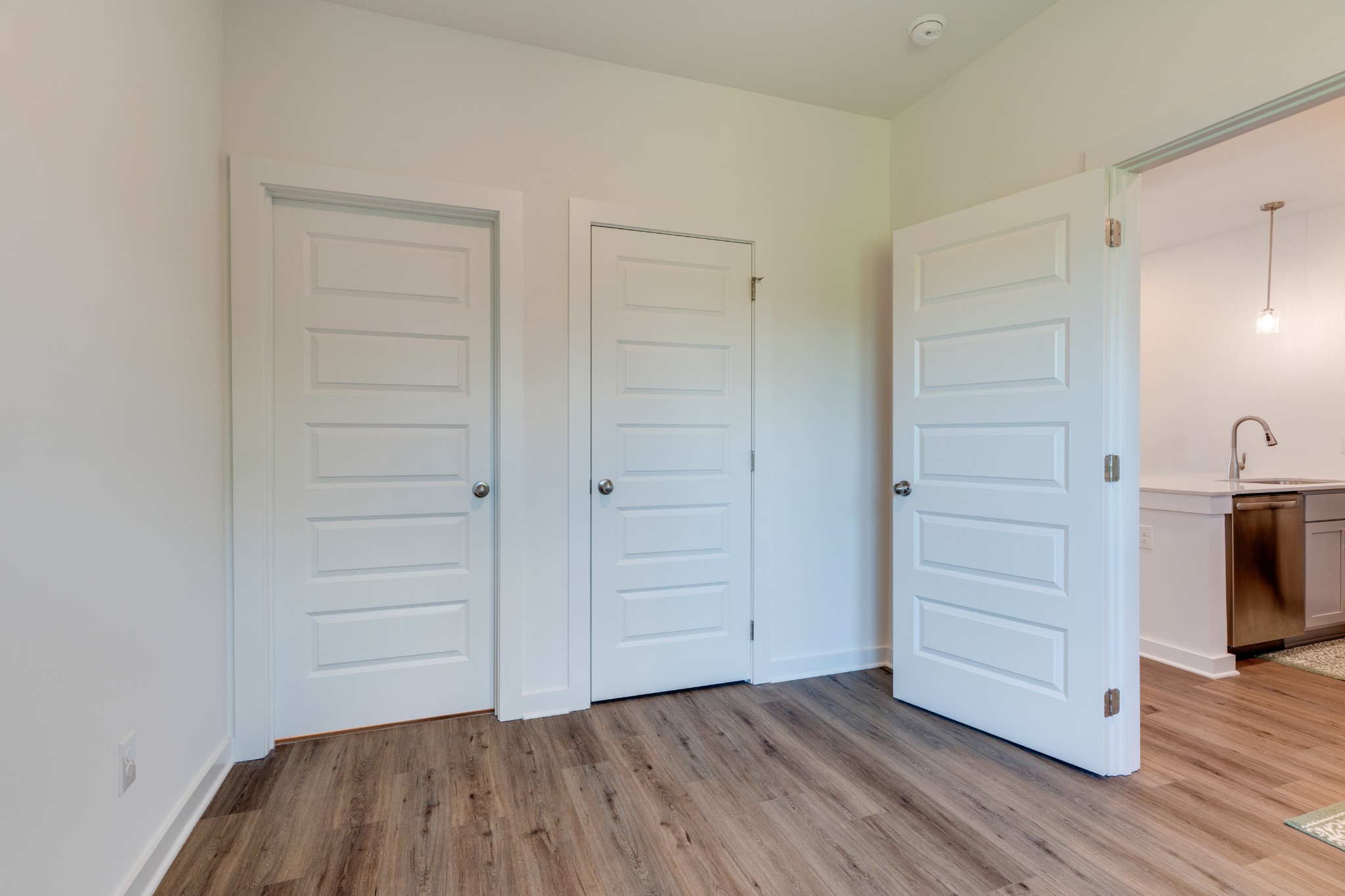 1573 Elliott Williams Way Gallatin, TN 37066 - Photo 13 of 32 an empty room with wooden floor closet and windows