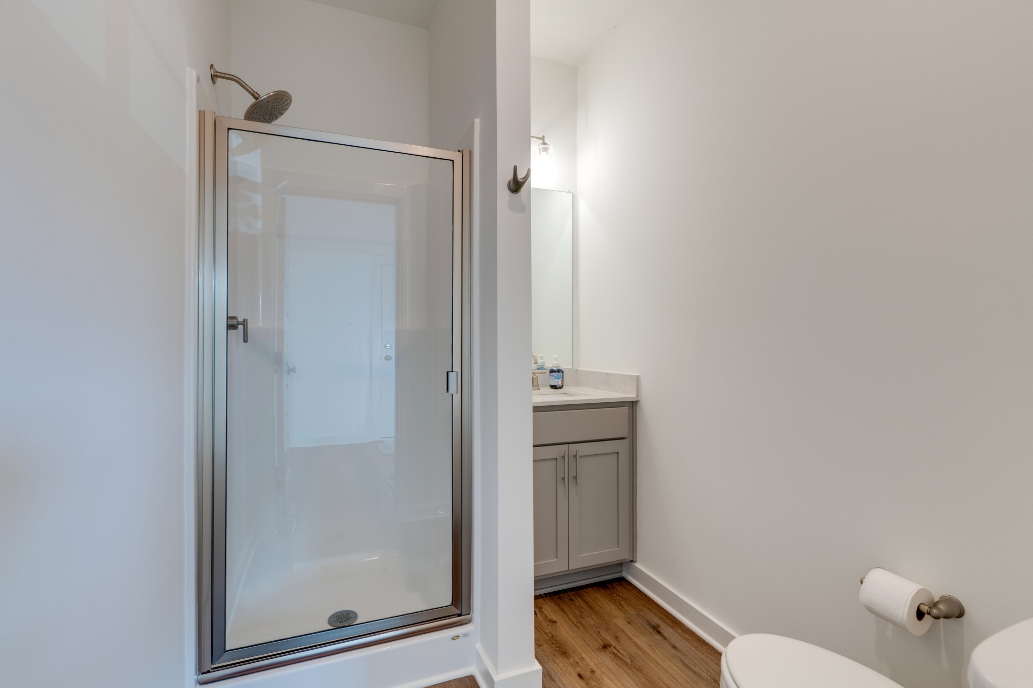 1573 Elliott Williams Way Gallatin, TN 37066 - Photo 15 of 32 a bathroom with a granite countertop toilet and a shower