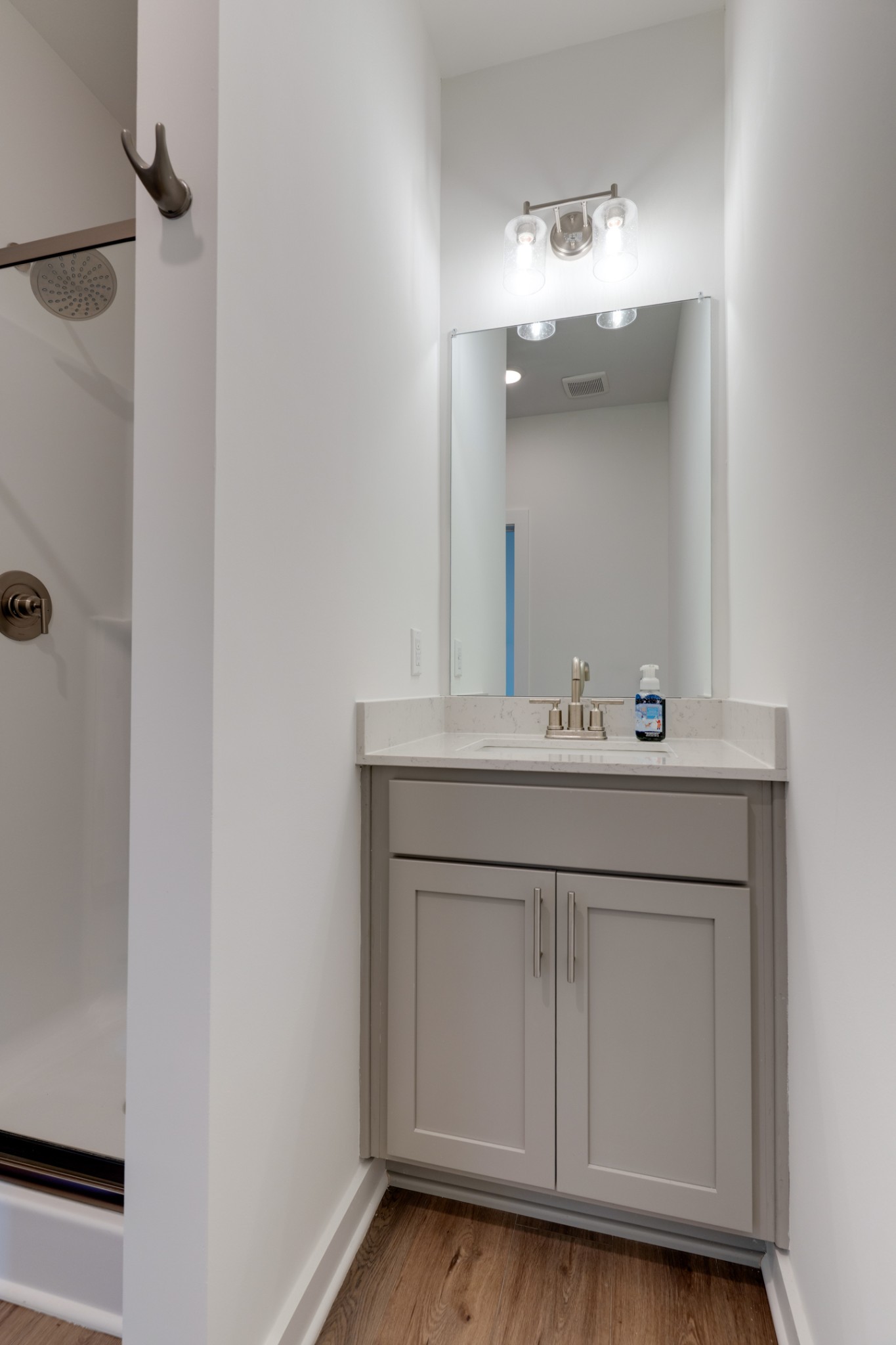 1573 Elliott Williams Way Gallatin, TN 37066 - Photo 16 of 32 a bathroom with a sink vanity and a mirror