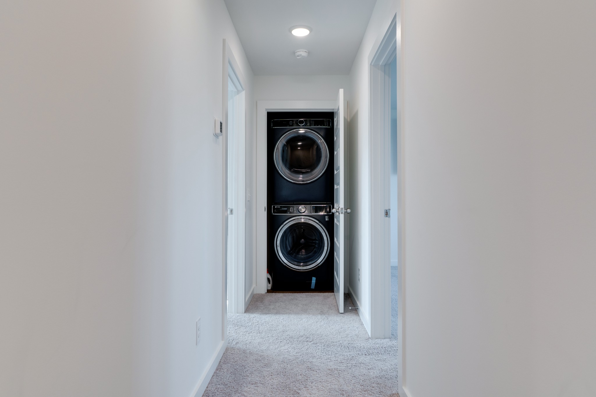 1573 Elliott Williams Way Gallatin, TN 37066 - Photo 18 of 32 a view of a hallway with washer and dryer