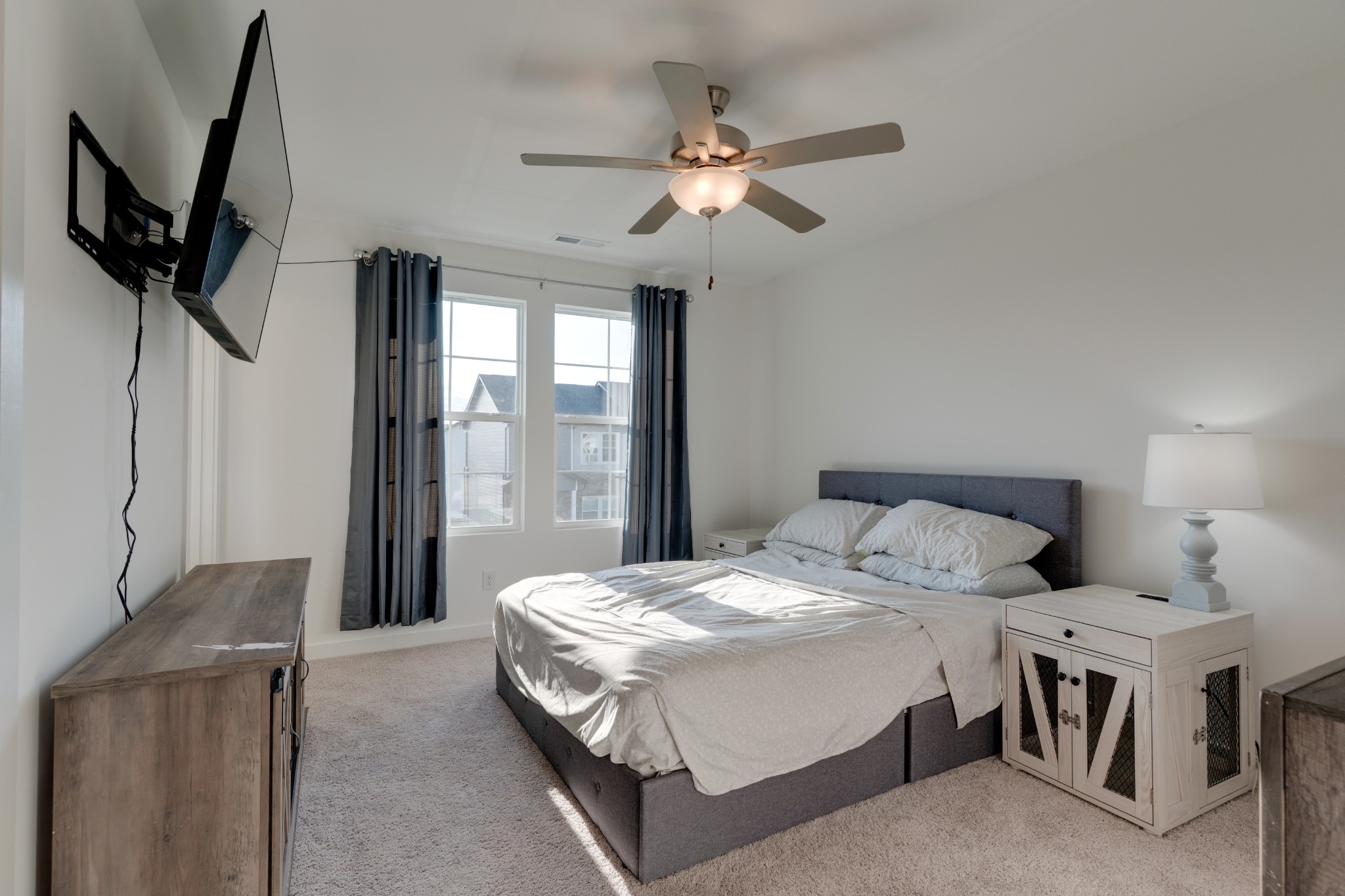 1573 Elliott Williams Way Gallatin, TN 37066 - Photo 20 of 32 a bedroom with a bed and a chandelier