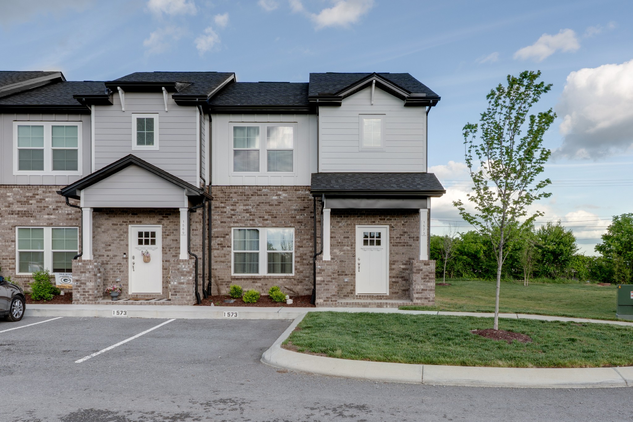 1573 Elliott Williams Way Gallatin, TN 37066 - Photo 2 of 32 a house that has a lot of windows and plants in front of it