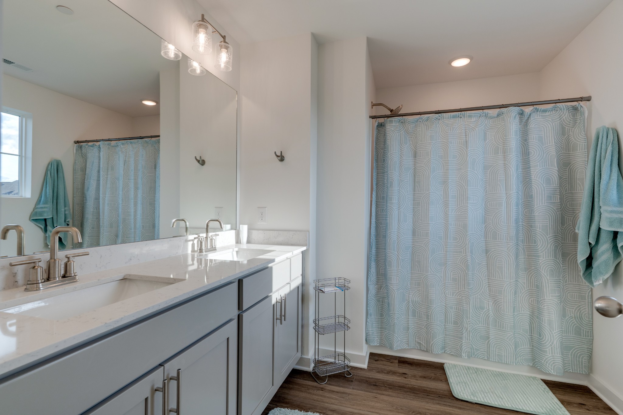 1573 Elliott Williams Way Gallatin, TN 37066 - Photo 24 of 32 a bathroom with a double vanity sink and a mirror