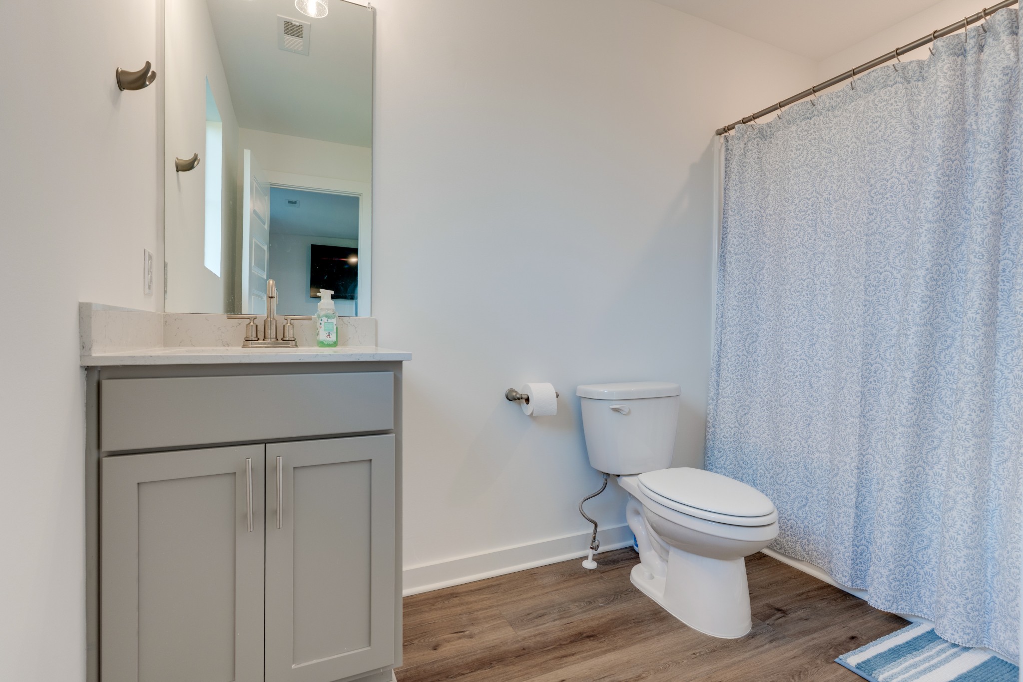 1573 Elliott Williams Way Gallatin, TN 37066 - Photo 29 of 32 a bathroom with a sink toilet and vanity