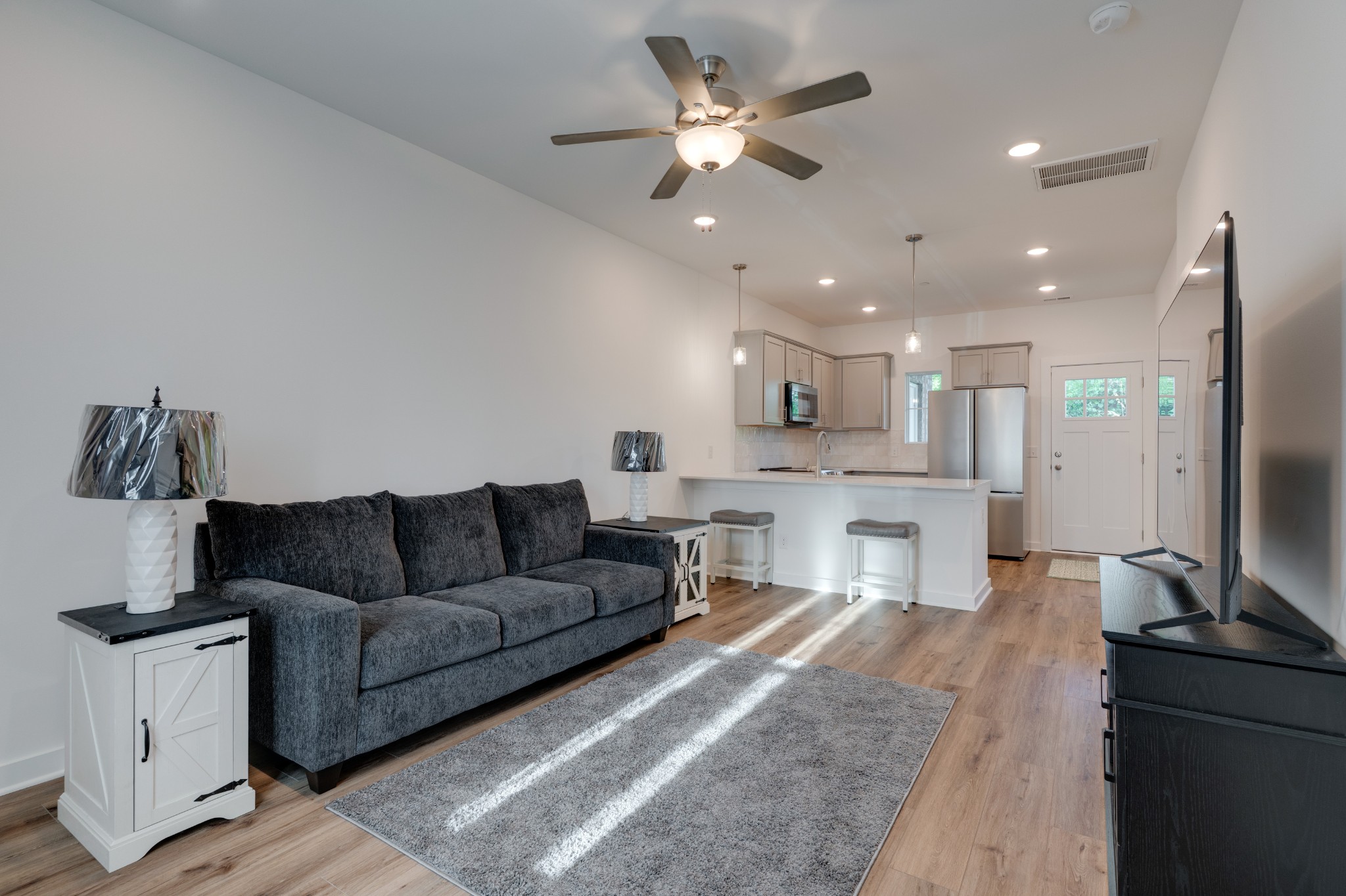 1573 Elliott Williams Way Gallatin, TN 37066 - Photo 5 of 32 a living room with furniture and kitchen view