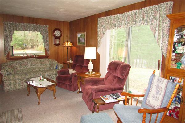 60 Farquhar Road Sturbridge, MA 01566 - Photo 12 of 30 a living room with furniture and a large window