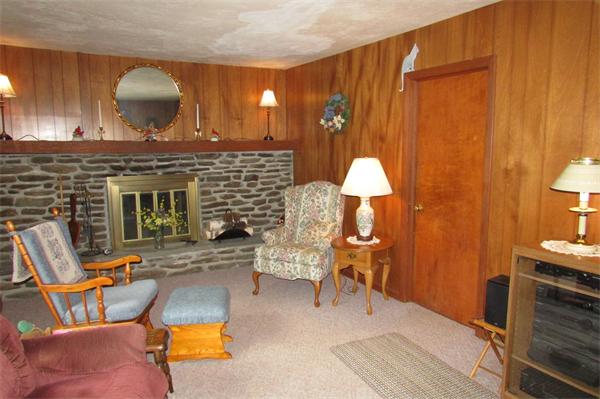 60 Farquhar Road Sturbridge, MA 01566 - Photo 15 of 30 a living room with furniture and a fireplace