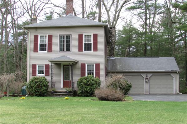60 Farquhar Road Sturbridge, MA 01566 - Photo 2 of 30 a front view of a house with a garden and plants