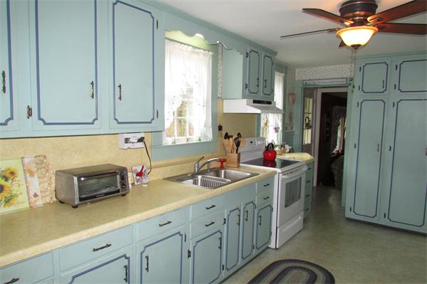 60 Farquhar Road Sturbridge, MA 01566 - Photo 8 of 30 a kitchen with sink cabinets and window