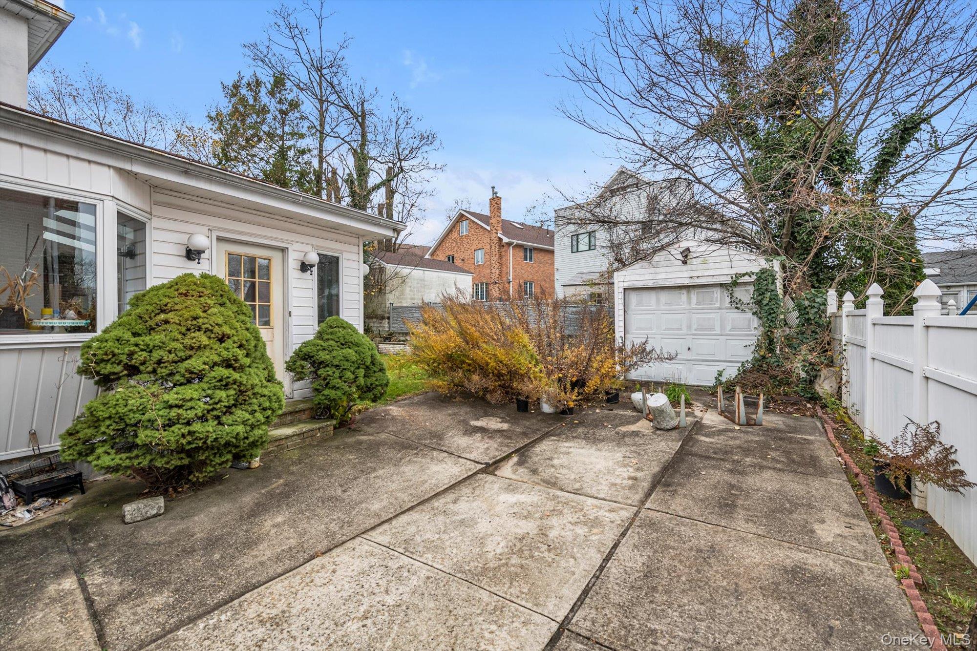 252-71 Brattle Avenue Queens, NY 11362 - Photo 17 of 20 a view of a house with a garden