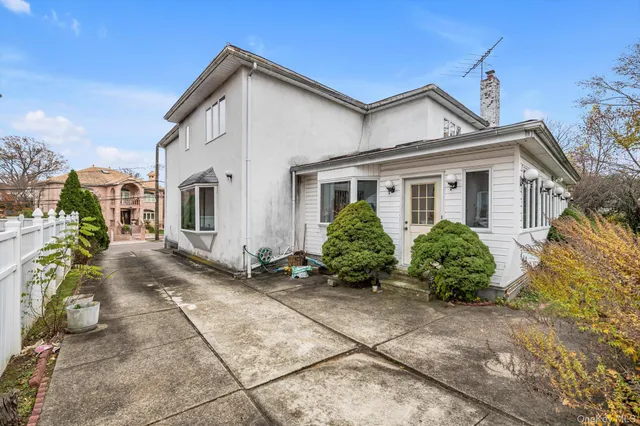 front view of a house with a small yard