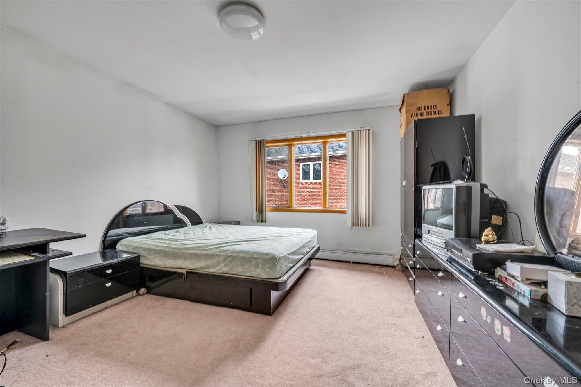 252-71 Brattle Avenue Queens, NY 11362 - Photo 7 of 20 a bedroom with bed and window