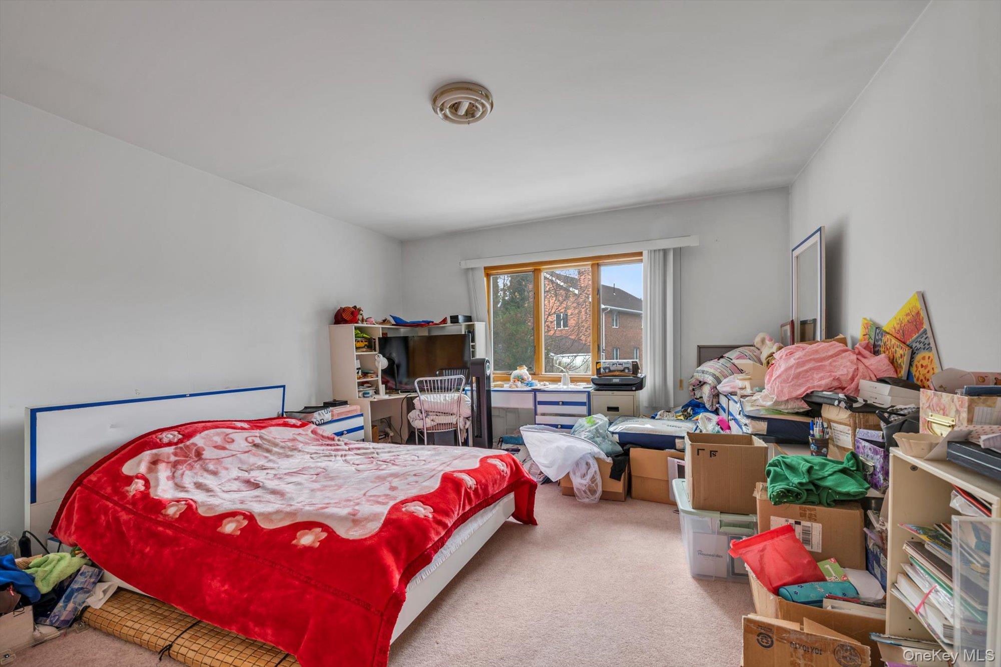 252-71 Brattle Avenue Queens, NY 11362 - Photo 8 of 20 a bedroom with bed and window