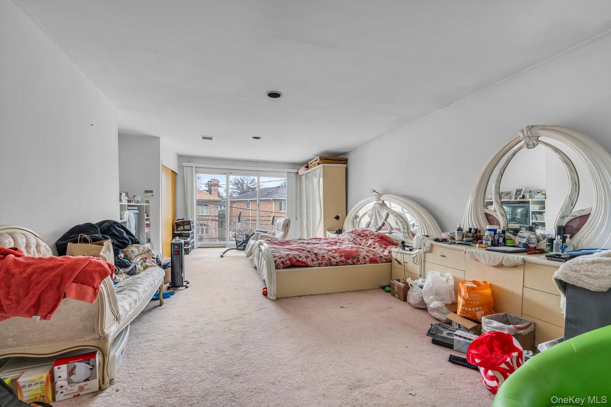 252-71 Brattle Avenue Queens, NY 11362 - Photo 9 of 20 a living room with furniture fireplace and window