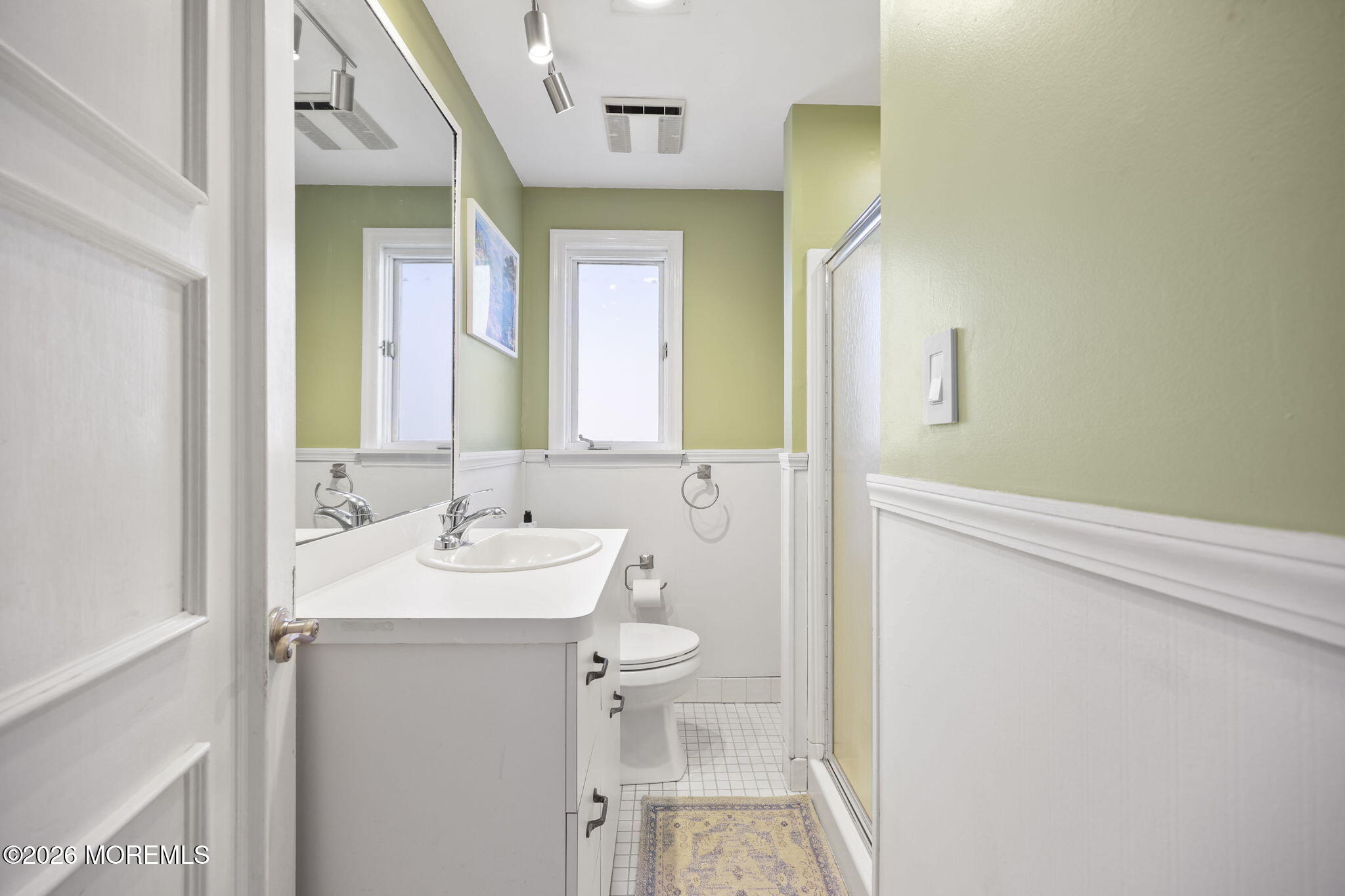 39 Manor Drive Red Bank, NJ 07701 - Photo 13 of 19 a bathroom with a sink and a mirror