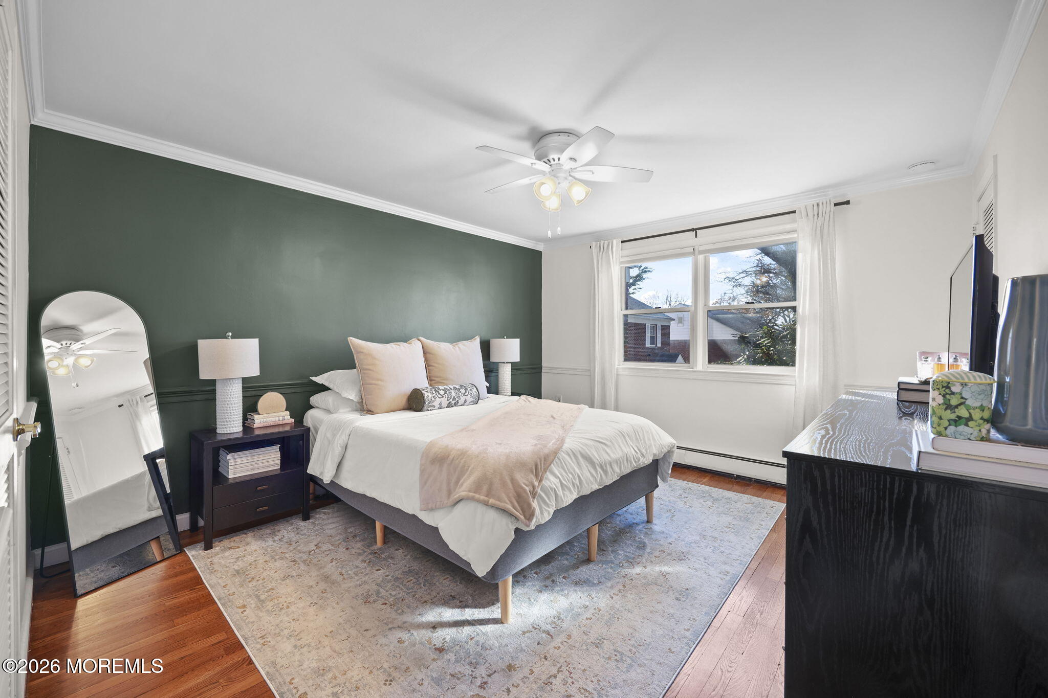 39 Manor Drive Red Bank, NJ 07701 - Photo 16 of 19 a spacious bedroom with a bed and a window