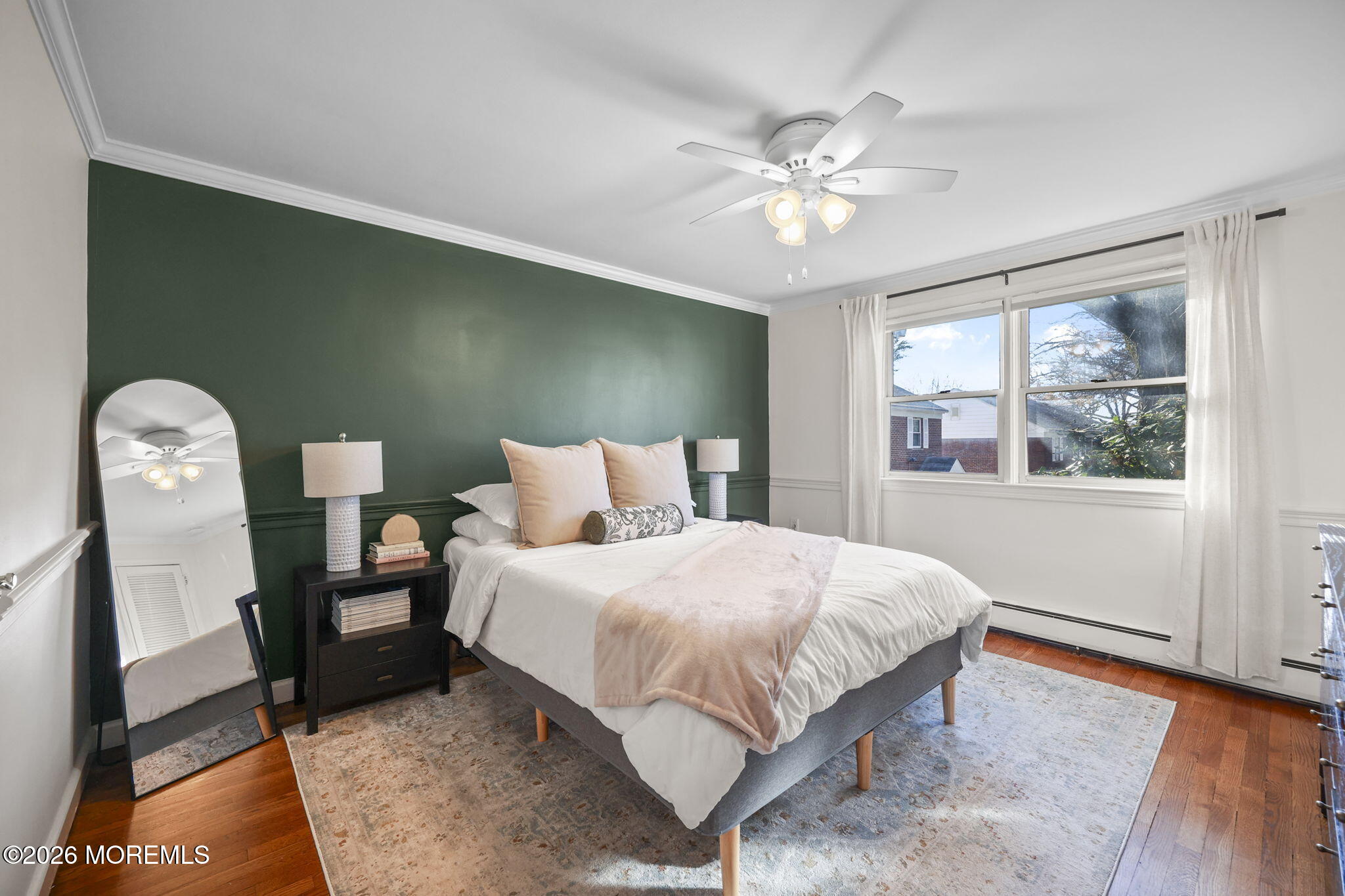 39 Manor Drive Red Bank, NJ 07701 - Photo 17 of 19 a bedroom with a large bed and a chandelier