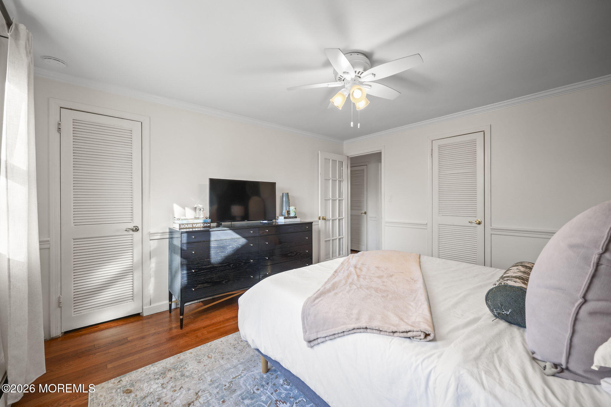 39 Manor Drive Red Bank, NJ 07701 - Photo 18 of 19 a bedroom with a large bed and a flat screen tv